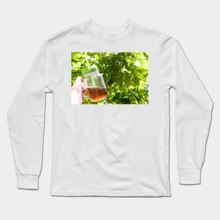 Hand holding a glass mug of cold tea Long Sleeve T-Shirt